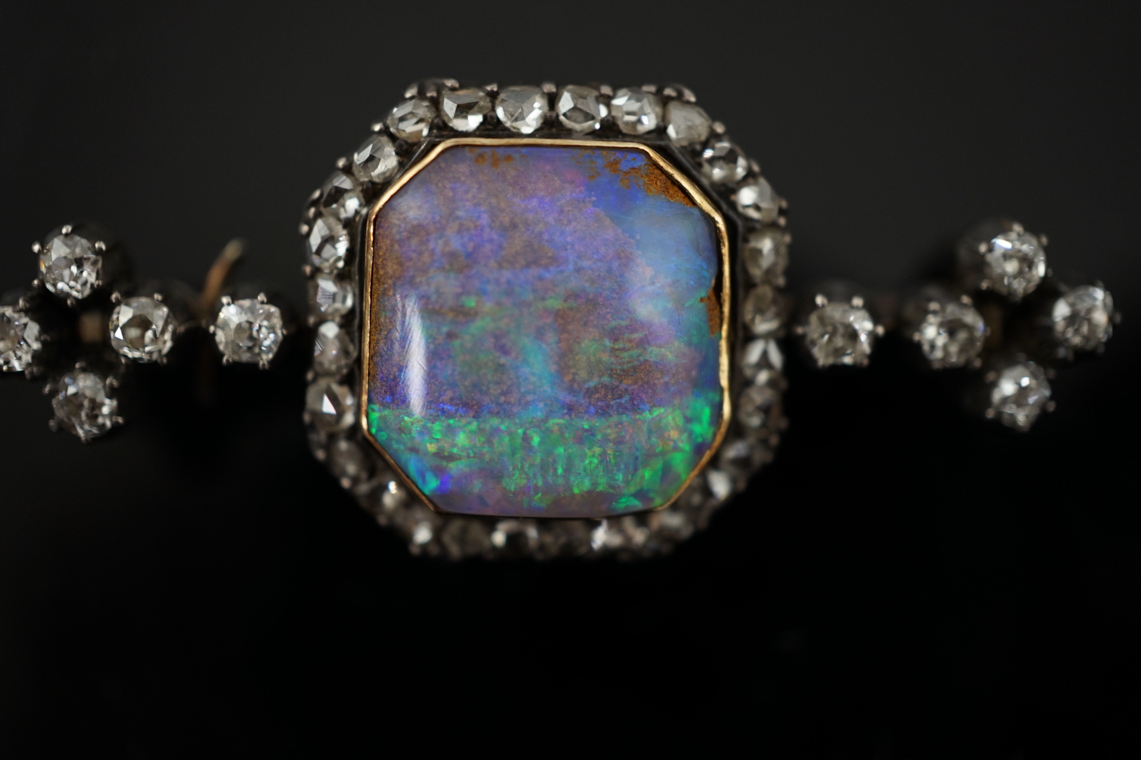 A late Victorian gold and silver, black opal and diamond cluster bar brooch